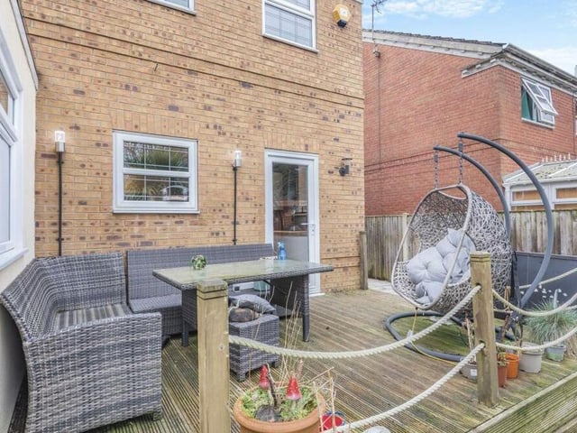 Sitting next to the garden room is this raised decked patio, which is a delightful spot for relaxing -- and maybe even al fresco dining -- when the weather is fine.