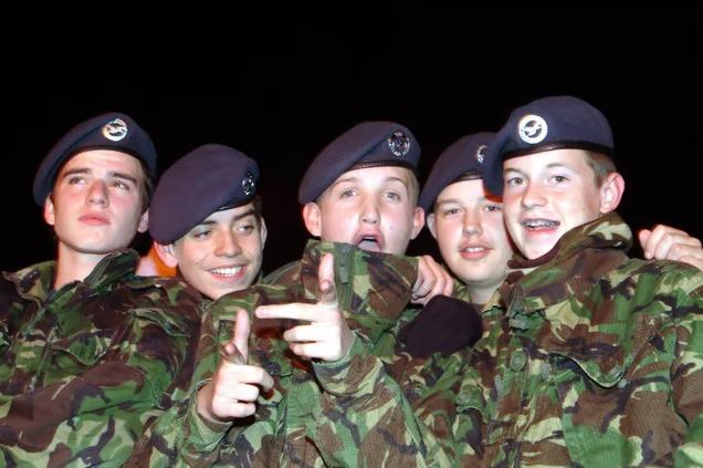 Cadets share a lighthearted moment while volunteering alongside event marshals to keep the bonfire burning safely