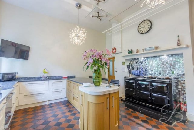 High-specification appliances in the kitchen include an integrated oven with five-ring gas hob, a Fisher and Paykel double-drawer dishwasher, fridge/freezer and wine fridge, while a Total Control electric Aga is negotiable to buy. A quarry-tiled floor adds to the appeal of the room.