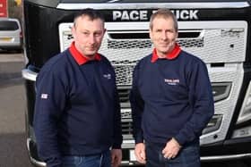 Mark Taylor truck driver and Peter Taylor (no relation) relief driver pose before setting off on their 1300 mile journey to Poland to deliver aid to the Ukrainian refugees.