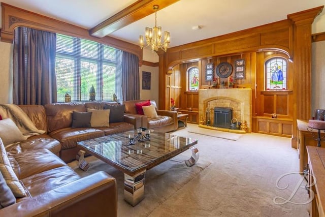 The main room on the ground floor of the Huthwaite property is this lovely lounge. Its most striking asset is a solid oak inglenook with feature fireplace, tiled surround and double stained-glass windows to the side.