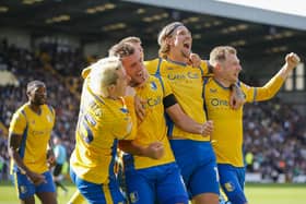 Delighted Stags celebrate a third goal at Meadow Lane in Saturday's memorable 4-1 local derby win over Notts County. Picture by Chris & Jeanette Holloway/The Bigger Picture.media.