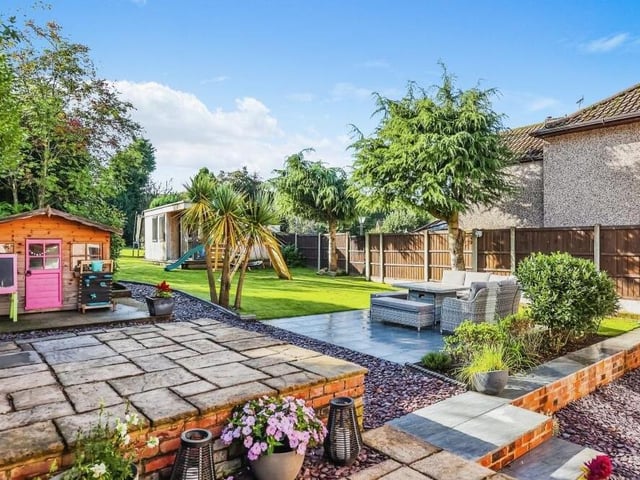 As well as the log cabin, there is plenty going on in the busy, south-facing back garden at the £580,000 house. There is space for playing, gardening  or entertaining as lawned, seating and paved areas mingle with mature trees and shrubs.