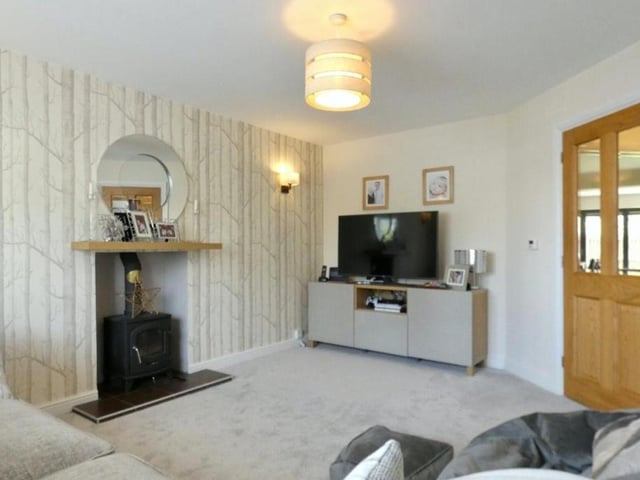 The living room from a different angle. Do you like the feature fireplace?