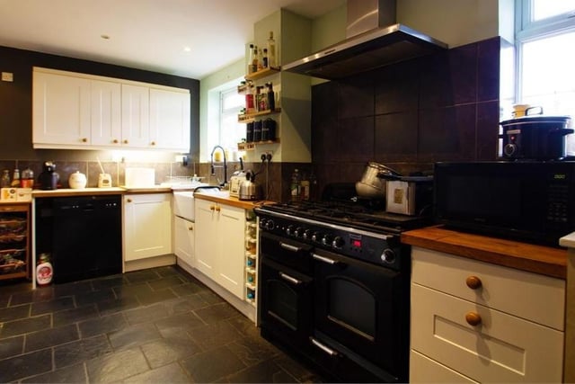 The charming kitchen is fitted with a range of modern wall and base units, and complementing worktops, incorporating a Belfast sink. There is space for a range cooker with an extractor hood over, and a range of additional appliances.