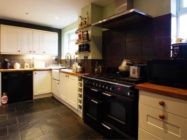 The charming kitchen is fitted with a range of modern wall and base units, and complementing worktops, incorporating a Belfast sink. There is space for a range cooker with an extractor hood over, and a range of additional appliances.