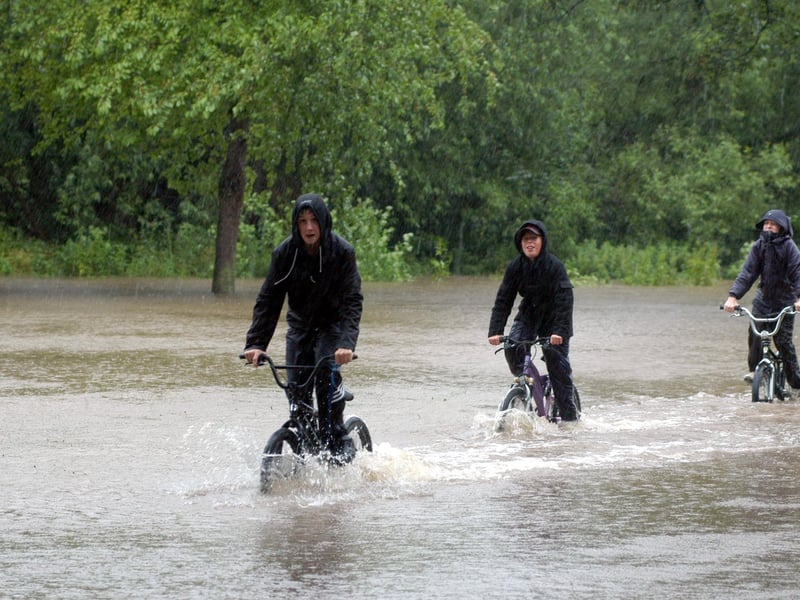 The A60 through Warsop flooded in June 2007. Were you one of these cyclists who decided to go for a swim?