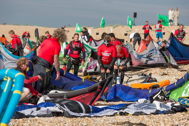 Kitesurfers prepare to take to the water at the Virgin Kitesurfing Armada off the coast of Hayling Island.