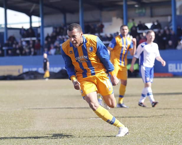Matt Green wheels away to celebrate after scoring from the spot at Barrow - Pic by Richard Parkes