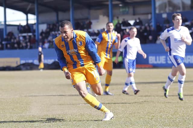 Matt Green wheels away to celebrate after scoring from the spot at Barrow - Pic by Richard Parkes