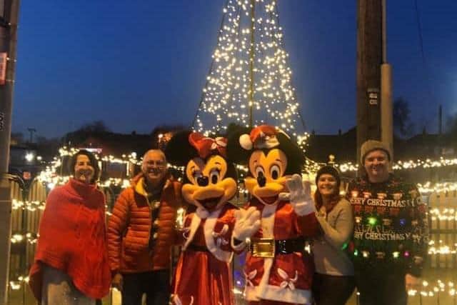 Mickey and Minnie Mouse meet four members of the Selston Christmas volunteers' committee, Lisa Simpson, Stuart Fletcher, Emma Olden and Sam Wilson.