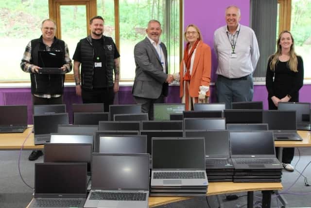 Portland College receiving 100 laptops from Capita, from left: Trevor Edwards, Daniel Stanway-Nock, Nick Bond, Dianne Jackson, Mark Dale, Grace Turner. Photo: Submitted