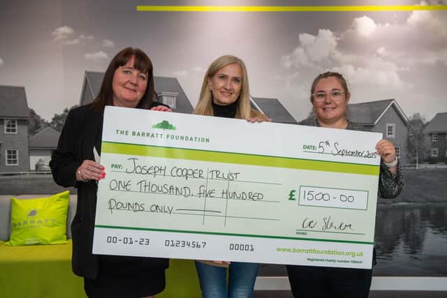 Beth Astle and Dawn Mellors (B&amp;DWH) presenting a cheque to Tracy Cooper
