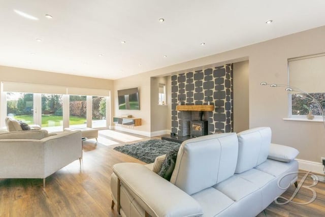Our tour of the Lichfield Lane gem begins in the lounge or living room, which is the hub of the house. Stand-out features are a log-burner and bi-folding doors that lead out to the garden.