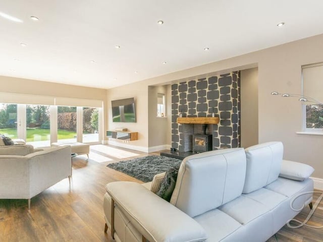 Our tour of the Lichfield Lane gem begins in the lounge or living room, which is the hub of the house. Stand-out features are a log-burner and bi-folding doors that lead out to the garden.