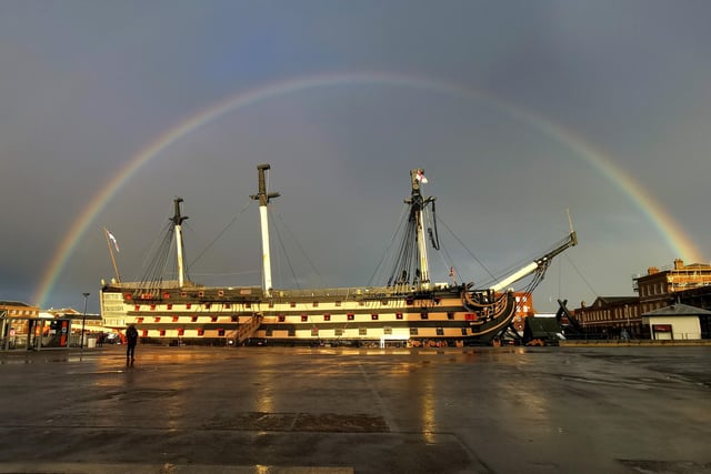 Have you ever seen a rainbow settle so perfectly? HMS Victory looks golden here.