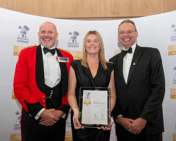 Proudly displaying the college’s Employer Recognition Scheme Gold Award are (from left) college governor Lieutenant Colonel Keith Spiers, Sian Geeson and Andrew Cropley MBE.