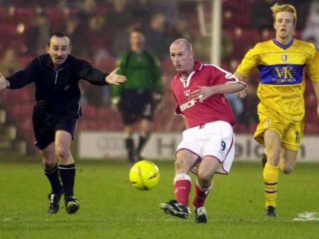 Mike Sheron gets the ball forward with Craig Disley in the background.