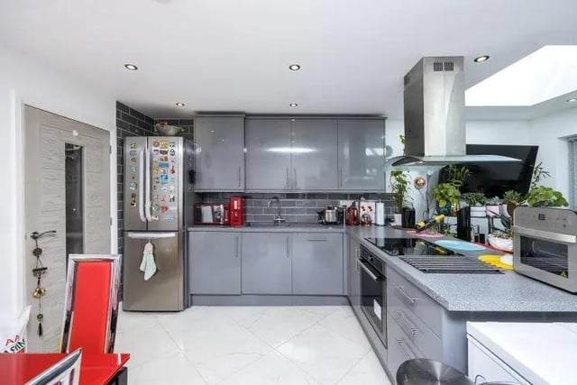 Our photo tour of the Percy Street property begins in the open-plan kitchen/diner and living area. This is the modern kitchen, which has a range of high-gloss wall and base units, plus integrated appliances.
