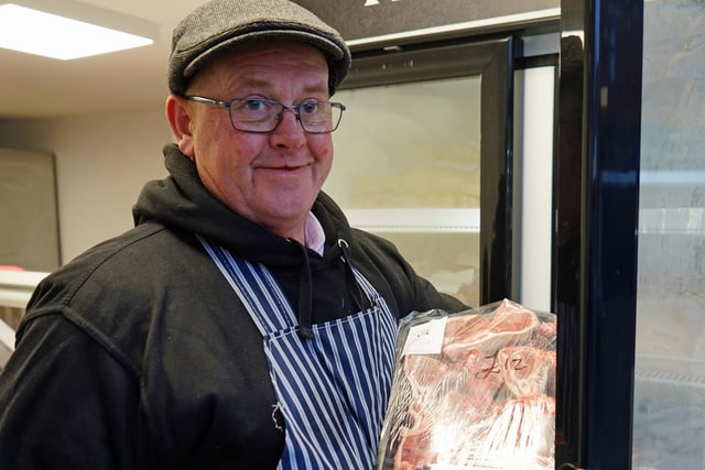 Ian is excited to serve existing and new customers. Seen butcher Ian Gillard holding lamb chops.