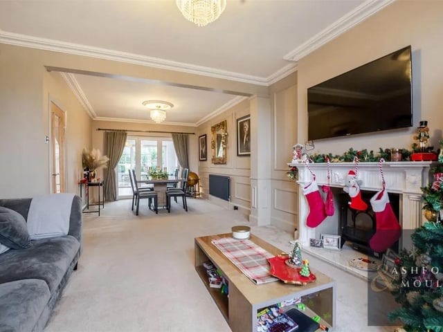 The living room flows into the dining room and is a welcoming hub for relaxing evenings or hosting friends and family.
