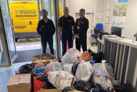 Lincs and Notts Air Ambulance representatives collect the donations amassed at National Highways’ offices near Annesley
