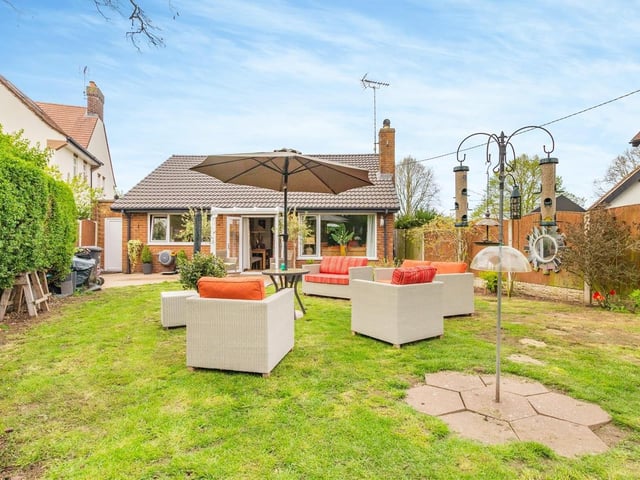 This is how the bungalow looks from the rear, complete with enclosed garden and patio.
