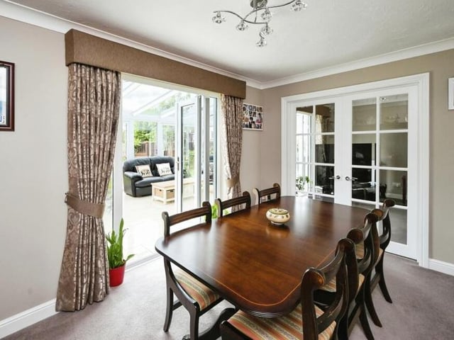 Just off the living room is this formal dining room, which is a lovely size for family meals.