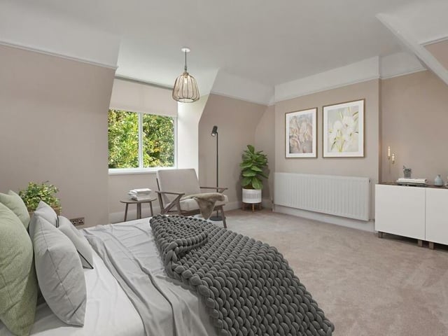 The fourth of the five bedrooms sits on the second floor. It is an attractive space with a double-glazed window facing the side of the house.