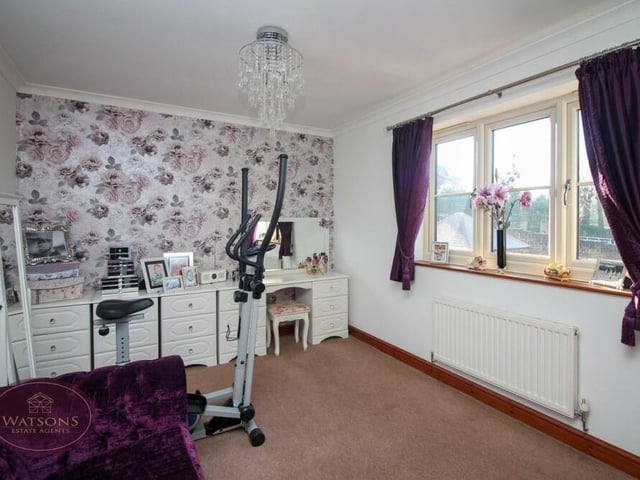 The fourth and final bedroom is the smallest but is a versatile space that could be put to multiple uses. It faces the front of the property.
