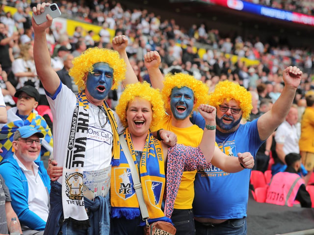 Mansfield Town fans watch the drama unfold inside Wembley.