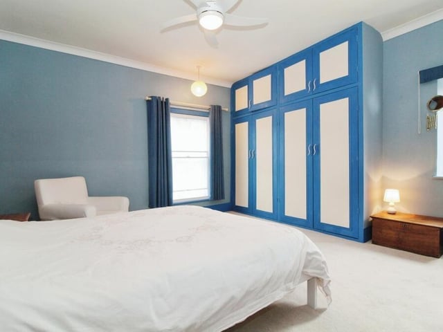 Time to go up to the first floor now to take a look at a handful of the six bedrooms. This one boasts a contemporary style and feel.