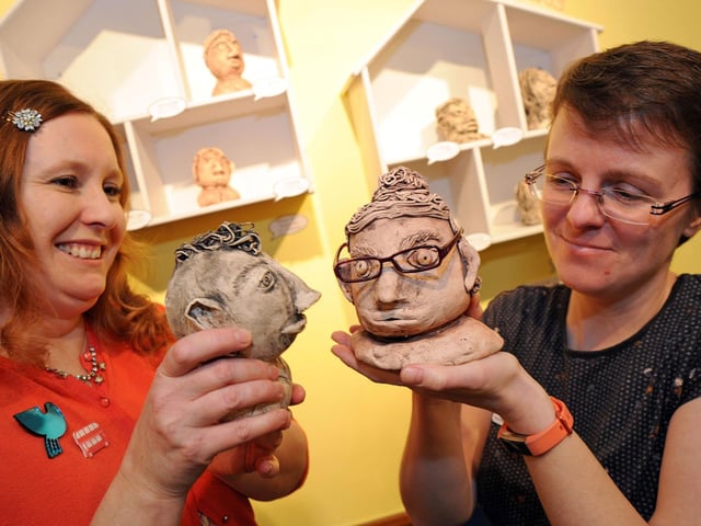 Clare Taylor, left, introduces some of the characters from her intergenerational arts exhibition 'This is Me, This is Mansfield' to Jodie Henshaw at Mansfield Museum on Saturday, at the start of the exhibition's run in 2018.