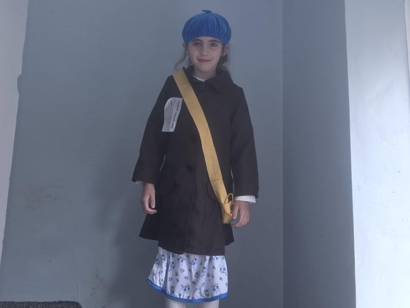 Ariella-Jae, aged seven, dressed as an evacuee for her wartime history project at school, commemorating VE day.