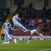 George Maris heads the winning goal at Rochdale. Photo Chris Holloway / The Bigger Picture.media