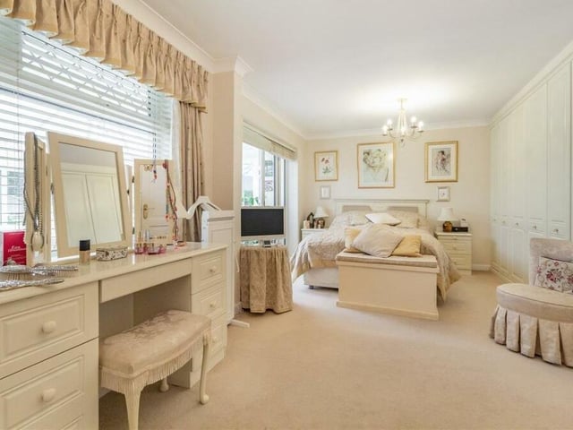 This second photo of the master bedroom emphasises what a substantial space it is. There is room for a full dressing table and lots of other bedroom furniture, while there is also access to an en suite shower room.