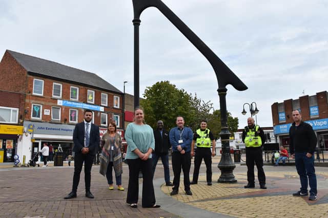Councillors Samantha Deakin and David Hennigan with Ashfield council officers at the sundial on Portland Square, Sutton
