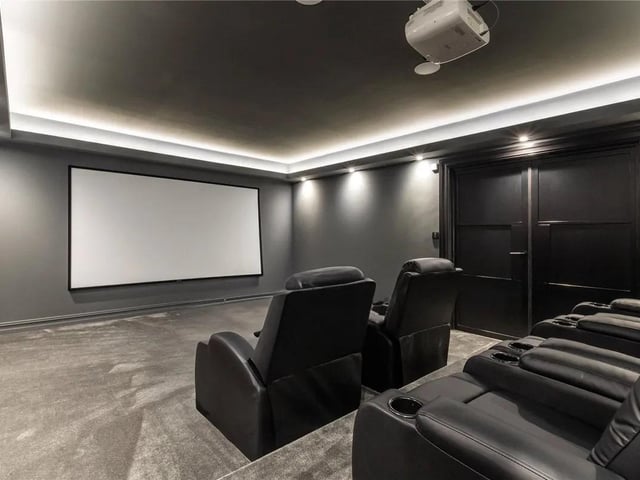 The cinema room is fully equipped for an immersive viewing experience in the comfort of your own home.
