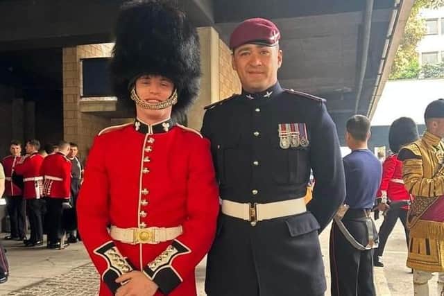 Former Kirkby schoolboys Nathan Musson, of the Irish Guards, and, right, Jordan Larua-Brooks, of the Parachute Regiment, bump into each other at the King's Coronation.