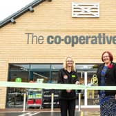 Natalie Smith, Co-op Warsop store manager, left, and Elaine Hopkins, cut the ribbon to officially open the new store, on High Street, Warsop, in August 2021.