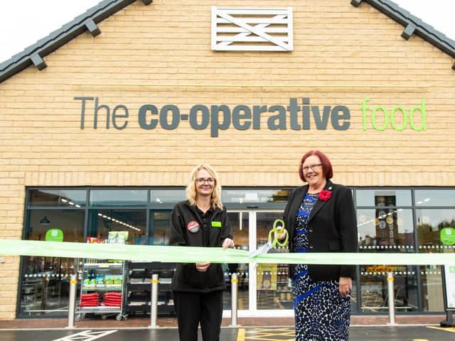 Natalie Smith, Co-op Warsop store manager, left, and Elaine Hopkins, cut the ribbon to officially open the new store, on High Street, Warsop, in August 2021.