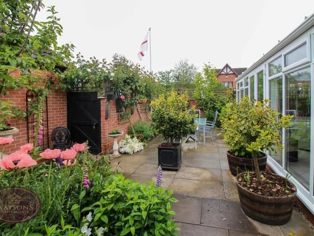 The garden scene outside the conservatory.