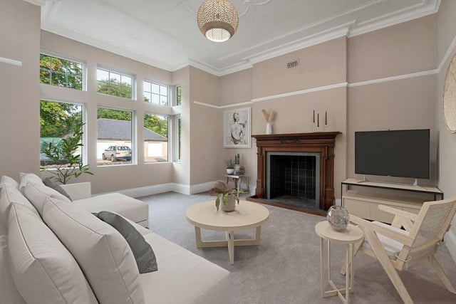 This lovely lounge is one of two large reception rooms on the ground floor of Abbeydale. Notably, it features a fireplace with open flue, tiled hearth and wood surround, while a large bay window overlooks the front of the property.