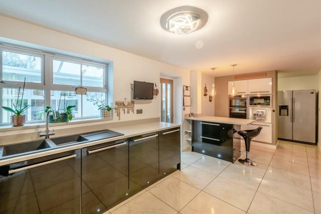 Other highlights of the kitchen include a polished ceramic-tiled floor and a large window overlooking the conservatory at the back of the property. There is also an access door to the conservatory.