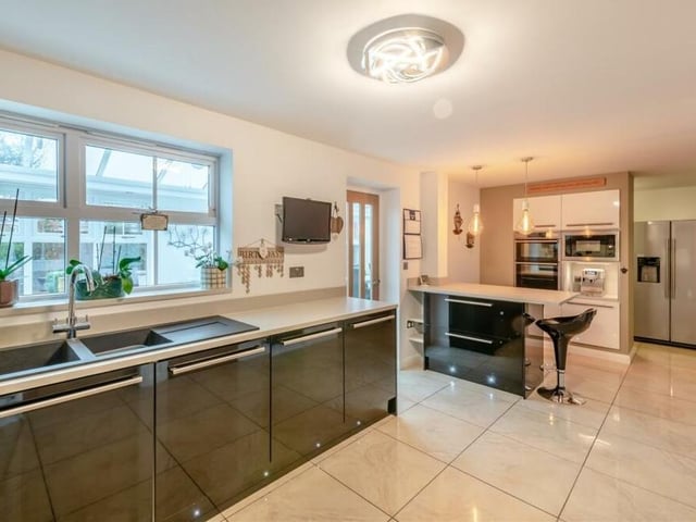 Other highlights of the kitchen include a polished ceramic-tiled floor and a large window overlooking the conservatory at the back of the property. There is also an access door to the conservatory.