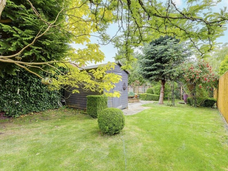 A shed, log store, courtesy lighting and a fence-panelling boundary make the rear garden even more appealing.