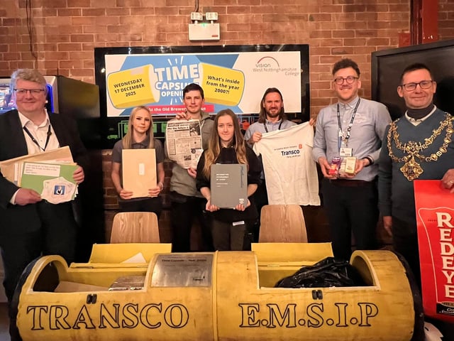 Construction students with some of the artefacts found inside the capsule