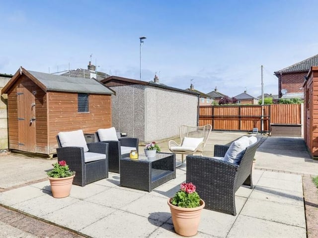Either side of the patio are two useful, timber-built sheds with power points. The rear garden also boasts courtesy lighting  and external power sockets.