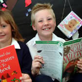Rachel and Ryan Mellins, aged six and eight at the time, who took part in the Big Wild Read summer reading project at Edwinstowe Library where they were presented with certificates and medals after completing six books. Year: 2007