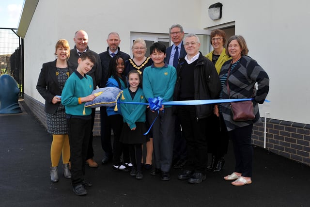 Chairman of Nottingham County Council, Coun Yvonne Woodhead joins members of the school council, headteacher Samantha Bradbury, Coun John Peck, govenors and invited guests to cut the ribbon at the opening of the new extension.